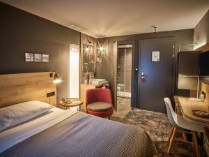 Postelja oz. postelje v sobi nastanitve Baxter Hotel