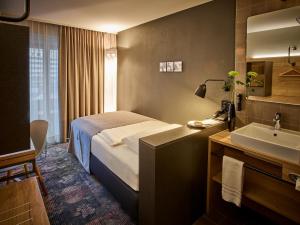 Postelja oz. postelje v sobi nastanitve Baxter Hotel