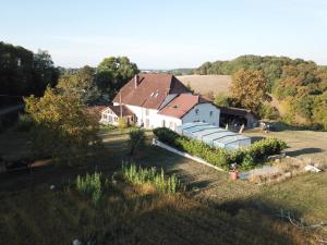 an aerial view of a house in a field at La Ferme De Montard in Montmorot