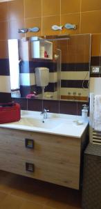 a bathroom with a sink and a mirror at la casa del pittore Anna house in Lerici