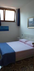 En eller flere senge i et værelse på la casa del pittore Anna house + 33 billeder