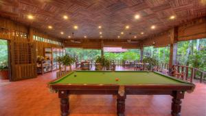 a pool table in the middle of a room at Palm Village Resort & Spa in Siem Reap
