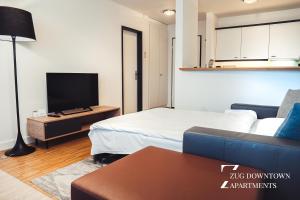 Postel nebo postele na pokoji v ubytování Zug Downtown Apartments