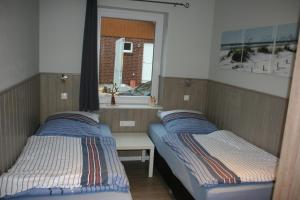 A bed or beds in a room at Holunder Hüsken