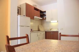 Kuchyň nebo kuchyňský kout v ubytování Apartments Delic