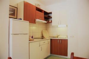 Kuchyň nebo kuchyňský kout v ubytování Apartments Delic