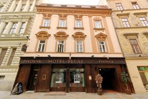 a building with a hotel in front of it at Hotel Pegas Brno in Brno