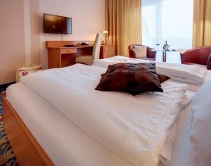 Voodi või voodid majutusasutuse Kurhotel Pyramide Bad Windsheim toas