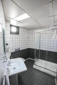 a bathroom with a sink and a shower at Rumi Hotel in Konya