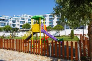 a playground with a slide in a park at Complex Moskoyani in Nesebar