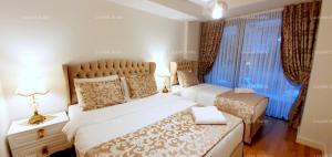 a bedroom with two beds and a window at Taksim leylak suite in Istanbul +17 photos