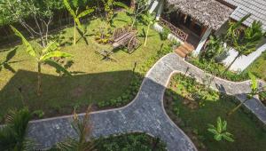 an overhead view of a garden with a walkway at La Rivière d' Angkor Resort in Siem Reap