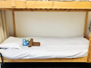 a bunk bed with a book and a stuffed animal on it at 板橋 RCアネックス Rc308 in Tokyo +30 photos