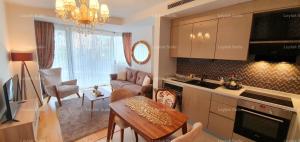 a kitchen and living room with a couch and a table at Taksim leylak suite in Istanbul