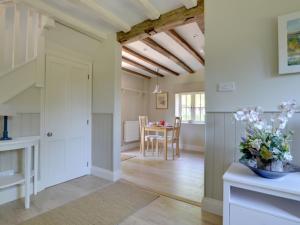 a kitchen and dining room with a table and chairs at Holiday Home Valley View by Interhome in Weald