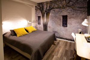 Ένα ή περισσότερα κρεβάτια σε δωμάτιο στο Hotel Vanha Rauma