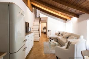 a living room with a couch and a table at Daplace - Gae Apartment in Milan