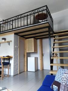 Voodi või voodid majutusasutuse Apartmani Sirmium toas