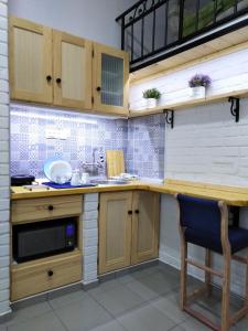 Kuchyň nebo kuchyňský kout v ubytování Apartmani Sirmium