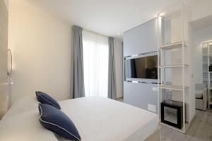 Postel nebo postele na pokoji v ubytování Hotel Baia + 37 fotografií