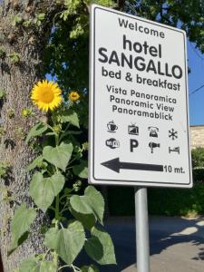 a sign for a hotelenna bed and breakfast with a sunflower at Hotel Sangallo B&B in Montepulciano