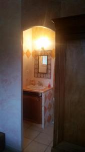 a bathroom with a sink and a mirror at BIENVENUE in Le Revest-le-Eaux