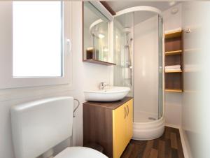 a bathroom with a sink and a toilet at Holiday Resort Medveja - by Liburnia Hotels & Villas in Medveja +46 photos