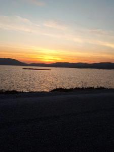 a sunset over a large body of water at Green House Boğaziçi-Dodo House in Bogazici