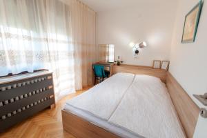 Posteľ alebo postele v izbe v ubytovaní Kuća Jankovića