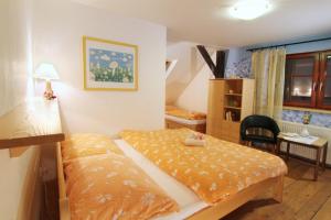 Кровать или кровати в номере Penzion Na Kopečku