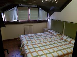 Ένα ή περισσότερα κρεβάτια σε δωμάτιο στο Apartamentos Casa Alcaire