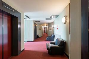 A seating area at Duomo Deluxe Room