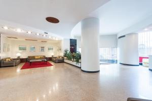 A seating area at Duomo Deluxe Room