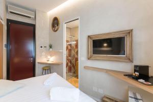 A bed or beds in a room at Duomo Deluxe Room