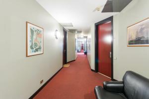 A seating area at Duomo Deluxe Room