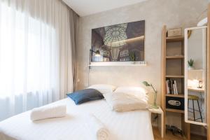 A bed or beds in a room at Duomo Deluxe Room
