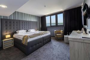Postel nebo postele na pokoji v ubytování Grand Hotel Riga