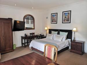 Een bed of bedden in een kamer bij Bon Ami Guest House