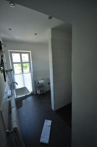 a bathroom with a sink and a toilet and a window at Apartments / Ferienwohnungen Moseluferstrasse in Neef +44 photos