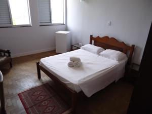 Grande Hotel Atibaia tesisinde bir odada yatak veya yataklar