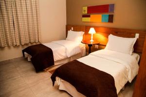 Ένα ή περισσότερα κρεβάτια σε δωμάτιο στο Pousada Jeito de Minas