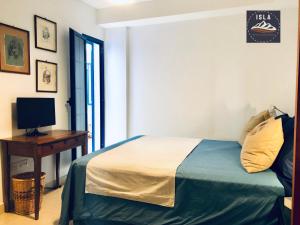 A bed or beds in a room at Terraza El Charco Arrecife
