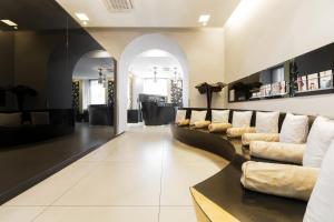 a living room with a row of couches at Palazzo Salgar in Naples