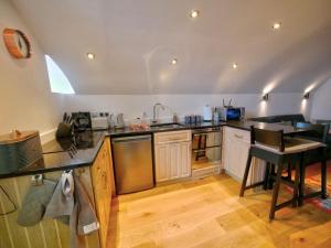 Kuchyň nebo kuchyňský kout v ubytování Pell Dell Apartment