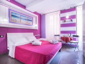 Krevet ili kreveti u jedinici u okviru objekta I Coralli rooms & apartments