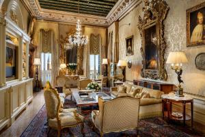 a living room with a couch and a table at Hotel Danieli, Venice in Venice