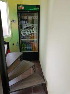 a refrigerator full of drinks in a room at Casa Vlad in Costinesti +25 photos