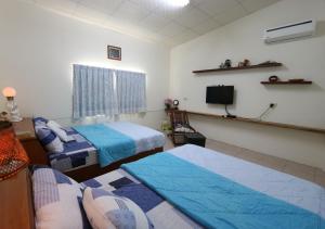 Letto o letti in una camera di Gods Home