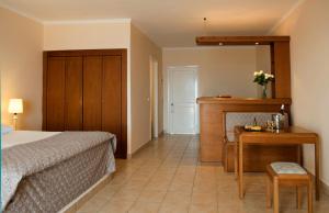 A bed or beds in a room at Mitsis Family Village