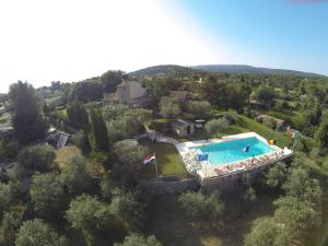 an aerial view of a villa with a swimming pool at La Vieille Bastide in Flayosc